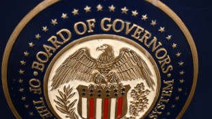 Gold hits record, stocks slip as Trump fuels Fed fears