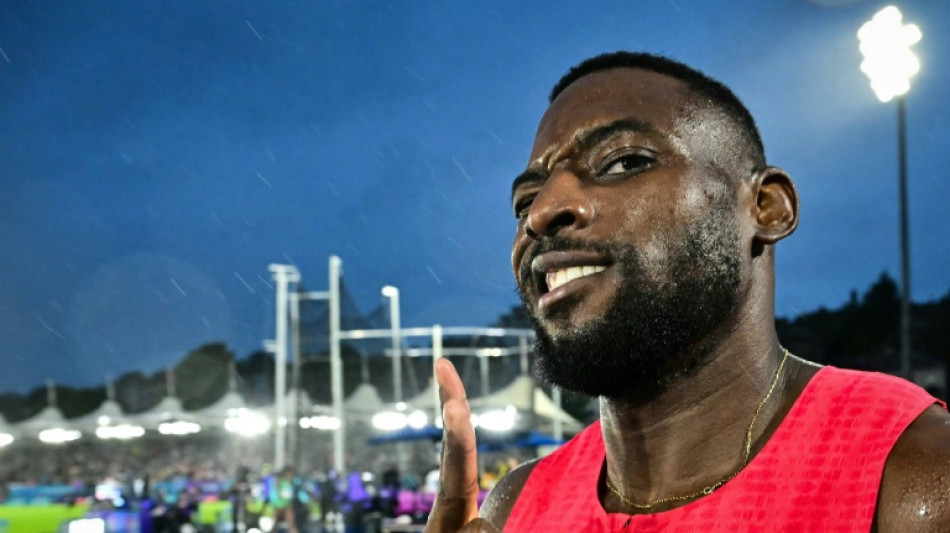  Cameroon's Eseme storms to 100m Commonwealth gold 