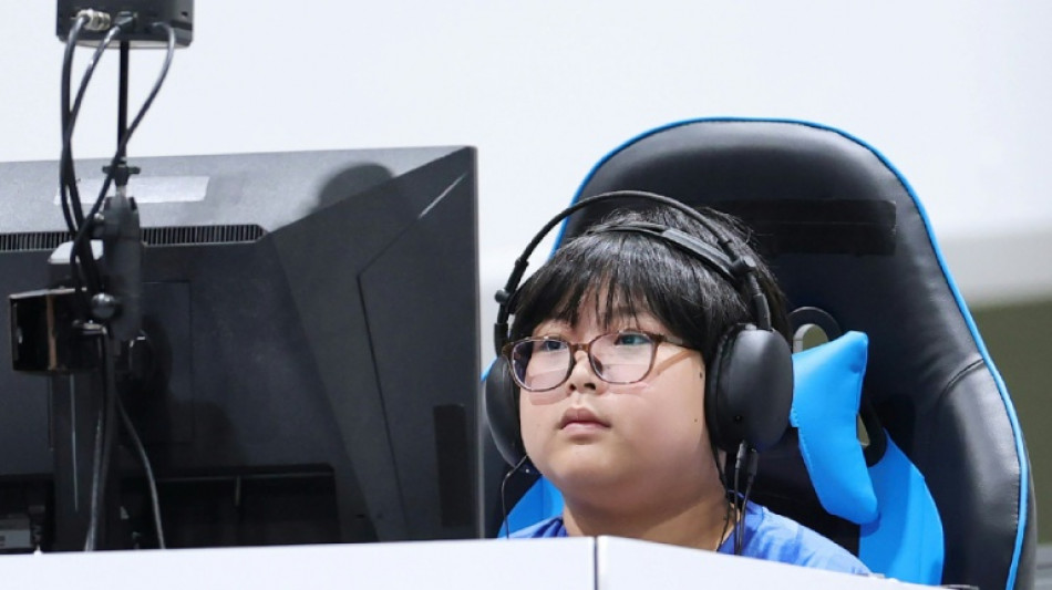  Japan schoolboy, 11, wins gold while empty seats blight Asian Games  
