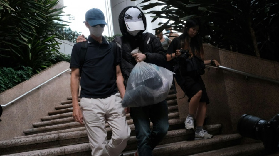  Hong Kong convicts father of wanted activist over handling of funds 