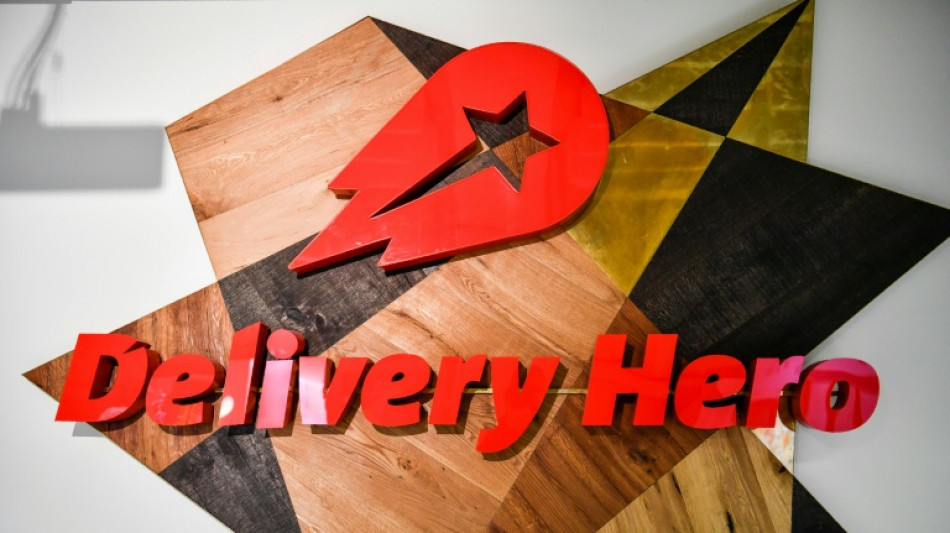  Germany's Delivery Hero agrees 12.7-bn-euro takeover by Uber 