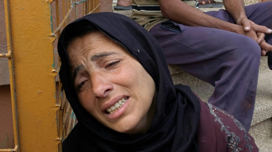 Gaza air strikes kill 94 as manhunt unfolds in West Bank