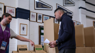 Polls open in Australian vote swayed by inflation, Trump