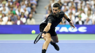 Djokovic shrugs off blisters to advance at US Open