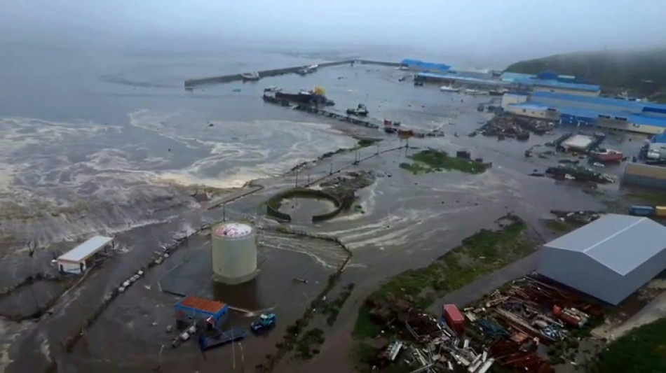 Russian TV shows buildings swept away as tsunami hits coast