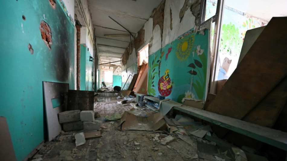 Children in war-torn Ukraine go back to school
