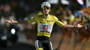 Pogacar breaks Alpe d'Huez record to extend Tour de France lead