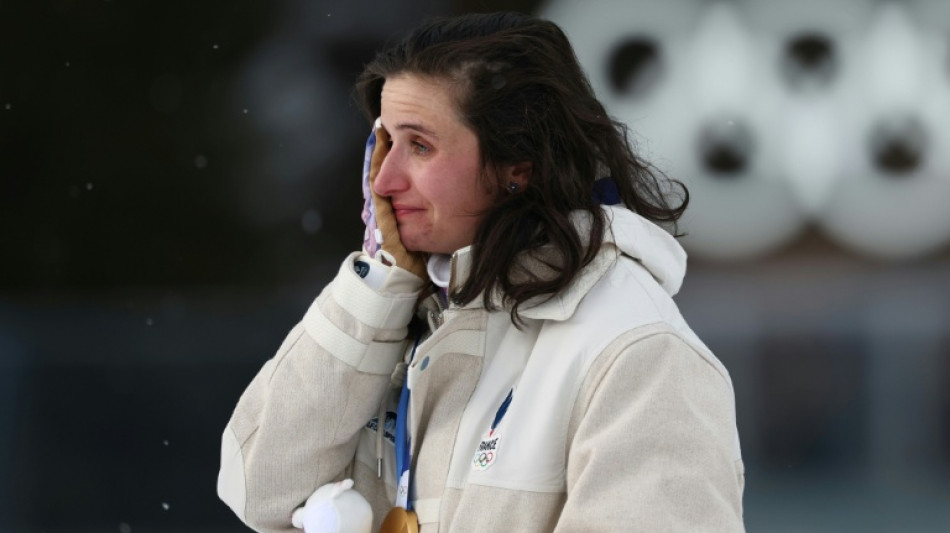  Simon in credit as controversial biathlete wins Olympic gold 