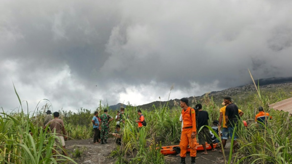  Indonesia rescuers retrieve hiker's body after volcanic eruption 