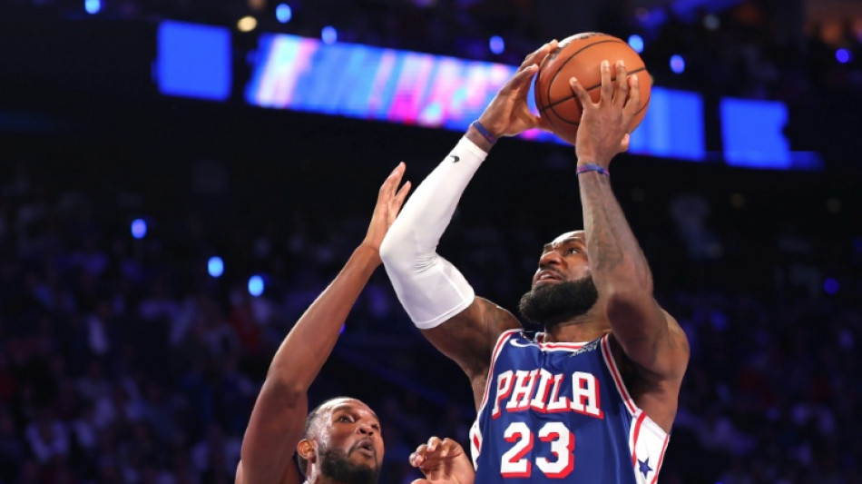  76ers rally to stun Cavs in James's first home game for Philadelphia 