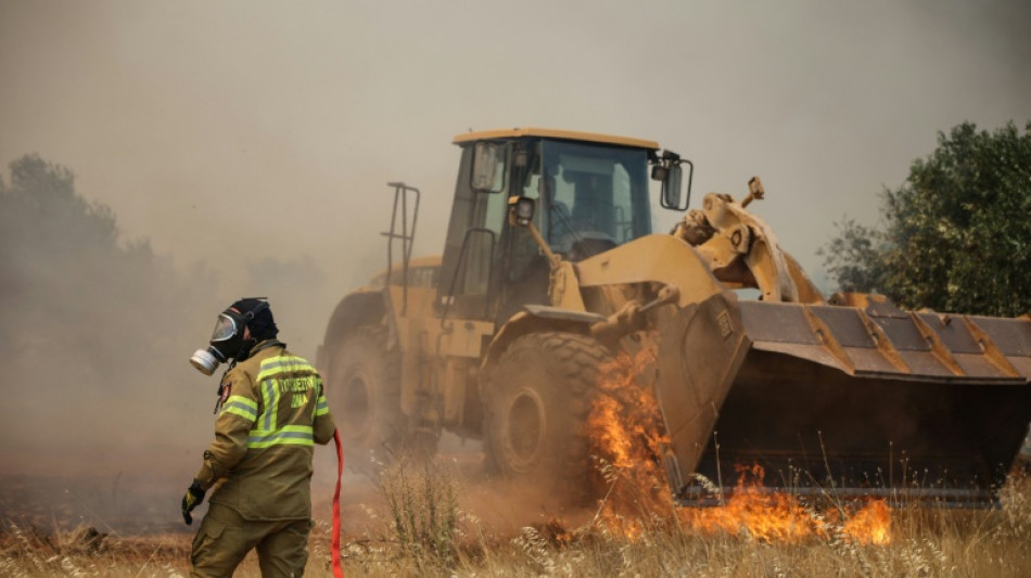  Wildfire flares up again in Greece as water bombers deployed 