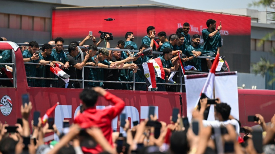  Hundreds welcome Salah's Egypt home after best World Cup run 
