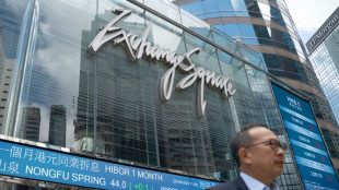 Asian stocks drop after Fed warning, oil dips with Mideast in focus