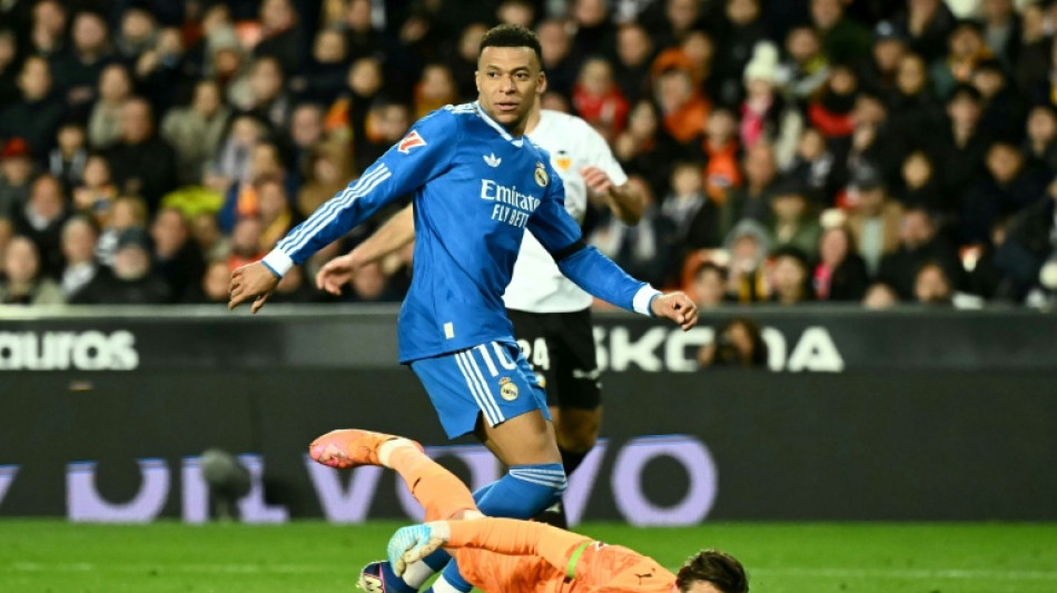 Real Madrid edge Valencia to stay on Barca's tail, Atletico slump