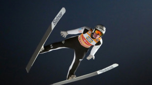 Domen Prevc soars to Four Hills ski jump title to emulate brother