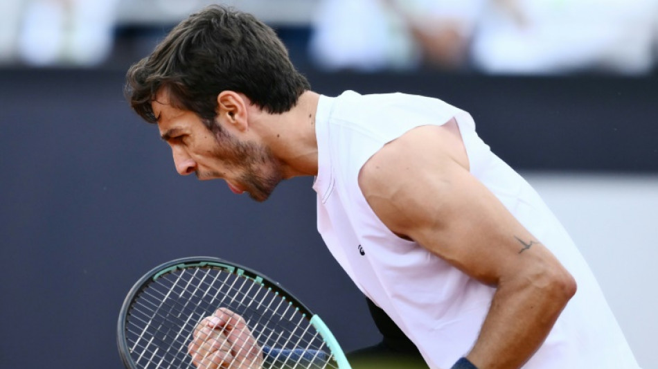 Musetti battles Medvedev and match-point rain delay to reach Rome quarters