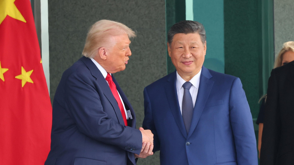  Stretta di mano tra Trump e Xi, al via la visita del leader cinese in Usa 