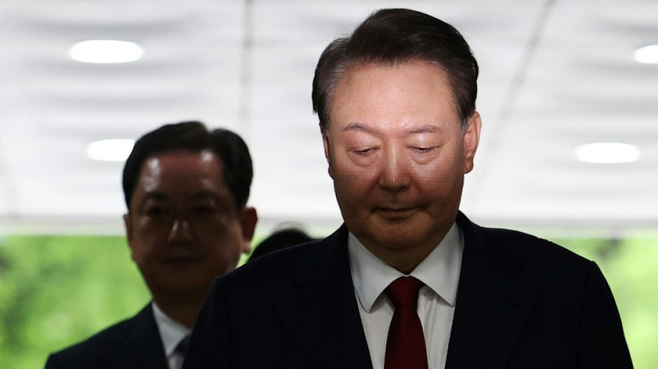 South Korea's Yoon resists questioning by lying in underwear