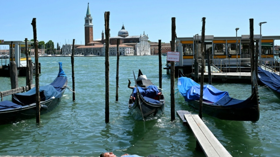 Europe bakes in summer's first heatwave as continent warms