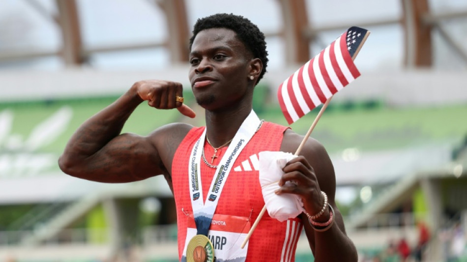  Tharp, 20, breaks 110m hurdles world record at NCAA championships 